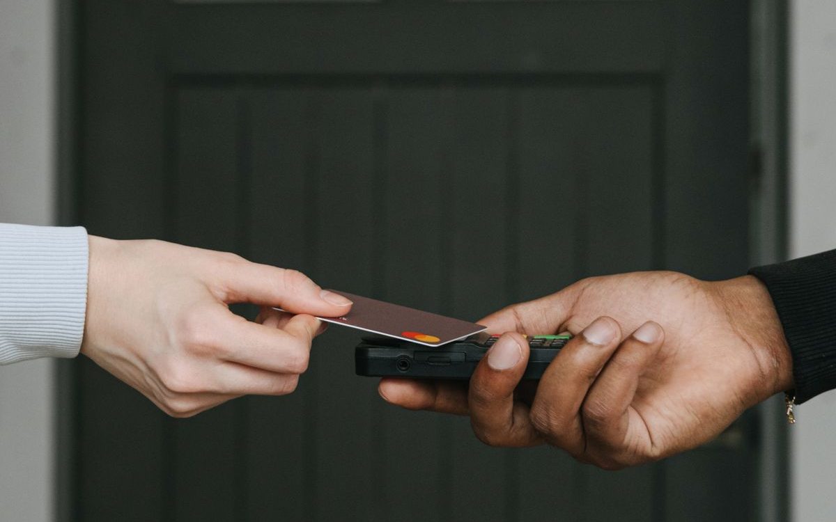Customer swiping a card at the counter